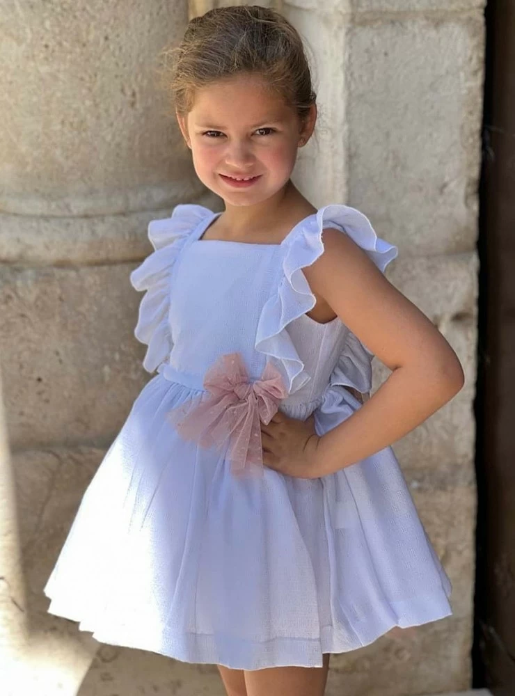 White dress with pink tulle bows. By Copo