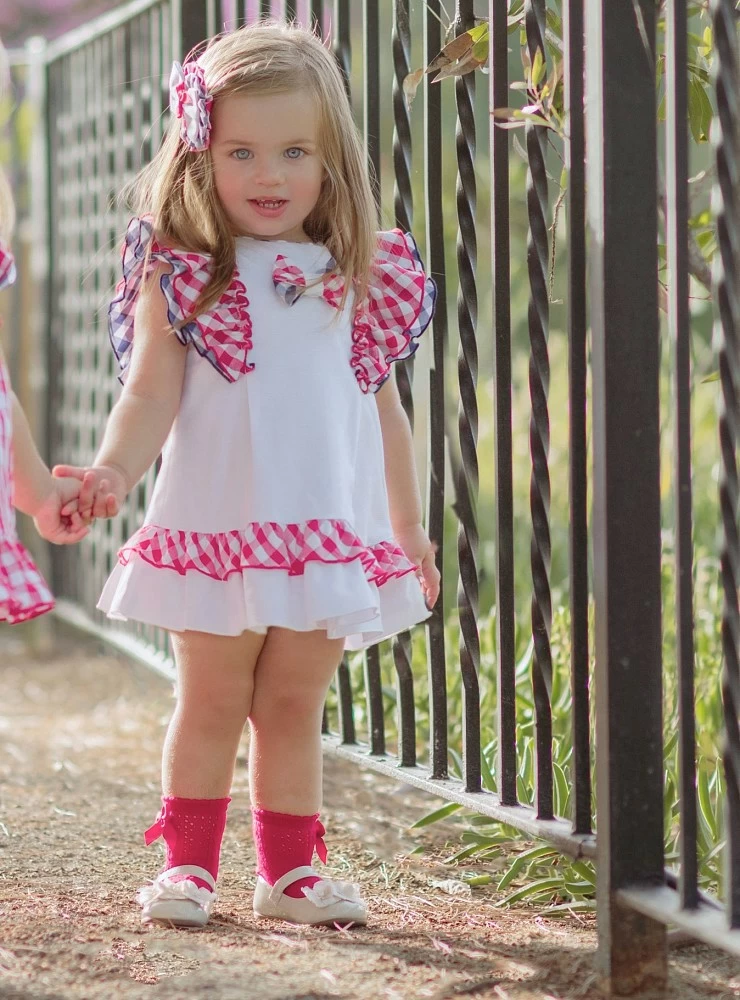 White evasé dress with red and navy Vichy