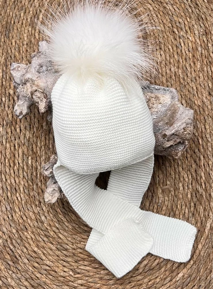 Wool hat with pom pom and scarf attached to the hat